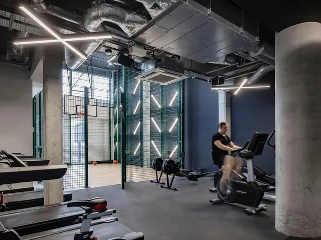 Treadmills exercise bike basketball court gym area at COSMOS in Sheffield Student Accommodation