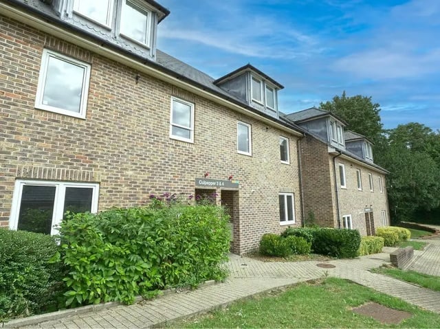 Brick building with dormer windows and landscaping exterior at Moulsecoomb Place in Brighton Student Accommodation