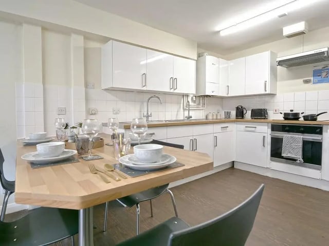 Table set with place settings and appliances Kitchen at Moulsecoomb Place in Brighton Student Accommodation