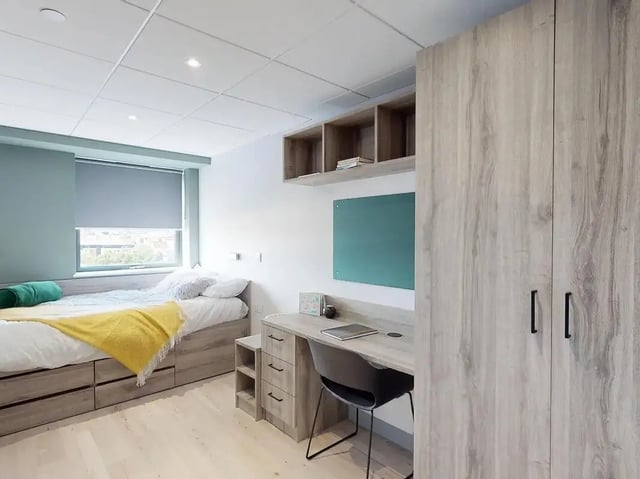 Bed desk wardrobe and shelves bedroom at Crown Place Swansea in Swansea Student Accommodation