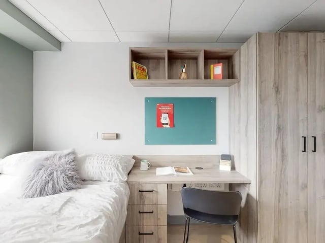 Bed desk chair whiteboard and closet bedroom at Crown Place Swansea in Swansea Student Accommodation