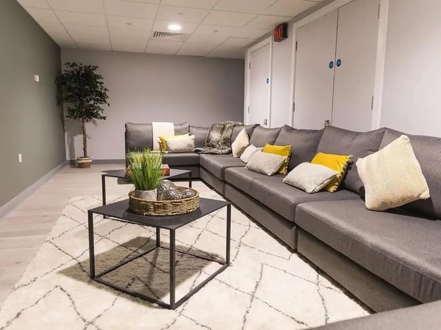 Large sectional sofa black coffee tables living room at Crown Place Swansea in Swansea Student Accommodation