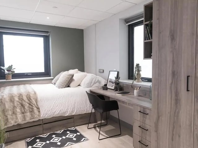 Bed desk and wardrobe student bedroom at Crown Place Swansea in Swansea Student Accommodation