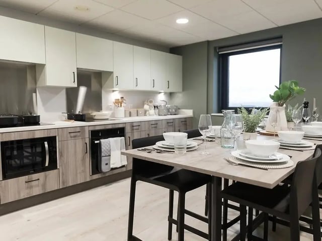 Tableware on dining table in modern kitchen at Crown Place Swansea in Swansea Student Accommodation