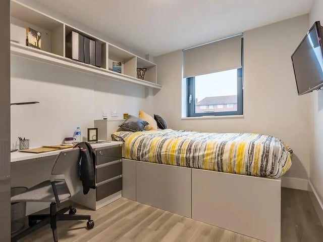Bed desk and shelves bedroom at ViBe Student Living in Kingston Upon Thames Student Accommodation