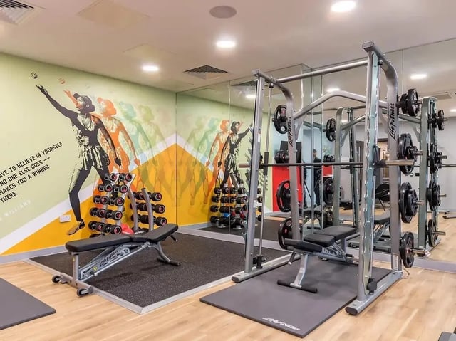 Dumbbells weights bench and mirror gym at ViBe Student Living in Kingston Upon Thames Student Accommodation