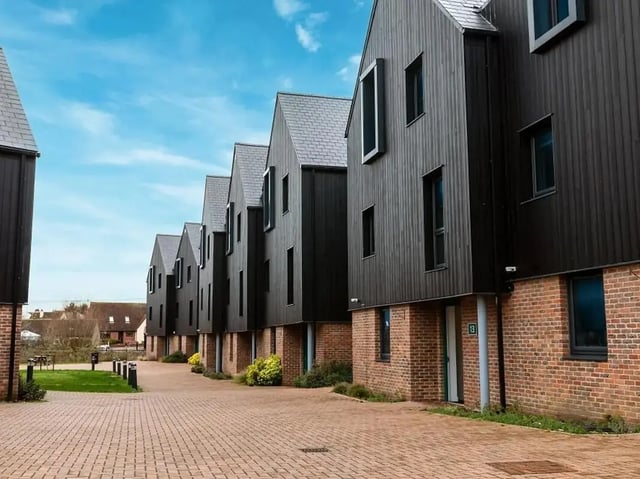 Modern black buildings brick base with windows exterior at Elmstead Place in Colchester Student Accommodation