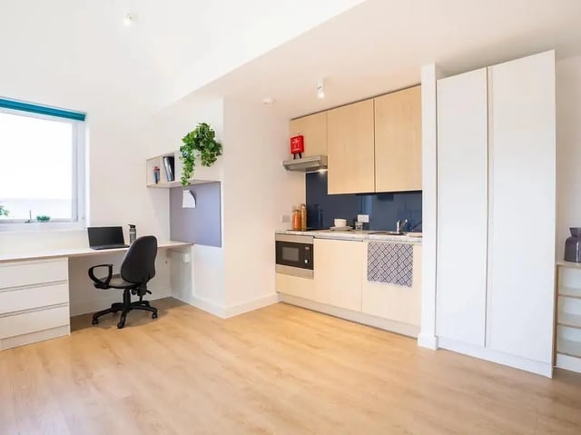 Desk laptop chair kitchen cabinets appliances studio at Elmstead Place in Colchester Student Accommodation