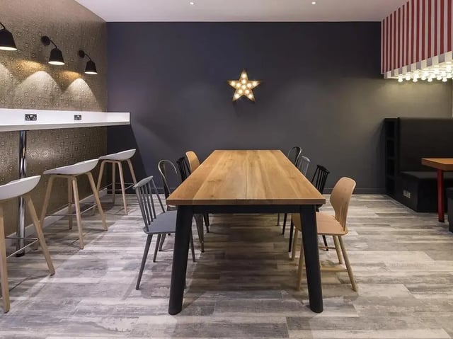 Dining table chairs bar stools star light communal area at Grand Felda House in Wembley Student Accommodation
