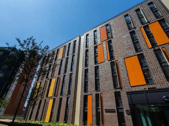 Brick building with orange window accents exterior at Grand Felda House in Wembley Student Accommodation