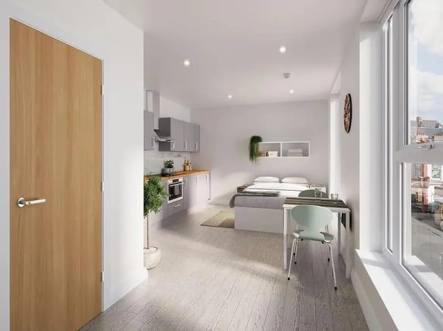 Bed kitchen table and chair studio apartment at The Reservoir in Plymouth Student Accommodation