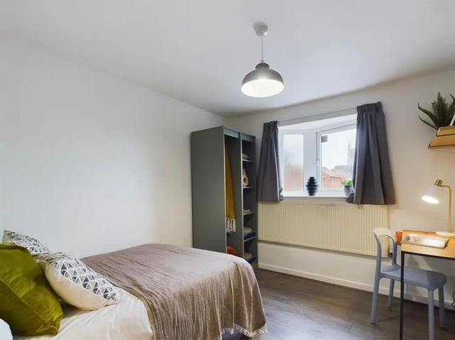 Bed wardrobe desk and window bedroom at 6 Bedroom House at 2, Flat 2, Windsor House, Clint Road West in Liverpool Student Accommodation