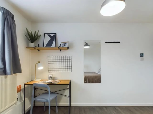 Desk lamp shelf grid mirror bed bedroom study area at 6 Bedroom House at 2, Flat 2, Windsor House, Clint Road West in Liverpool Student Accommodation