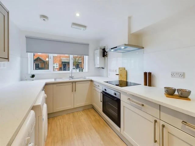 White cabinets sink oven and washing machine kitchen at 6 Bedroom House at 10, Mint Road in Leicester Student Accommodation