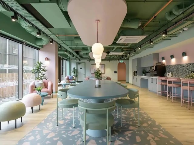 Modern communal area with dining table and kitchen at Yugo Bottleworks in Cork Student Accommodation