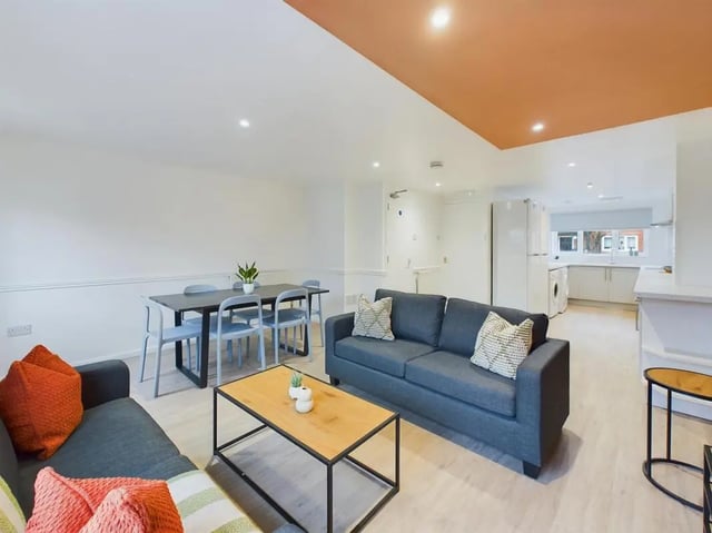 Two sofas dining table and chairs living room at 6 Bedroom House at 8, Mint Road in Leicester Student Accommodation