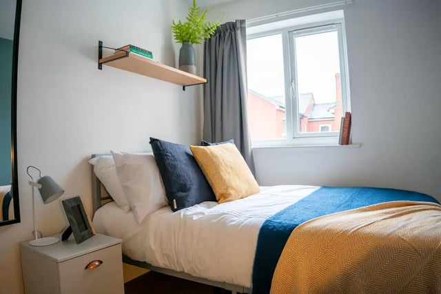 Bed pillows blankets window bedside table bedroom at 6 Bedroom House at 64A, Monson Street in Lincoln Student Accommodation