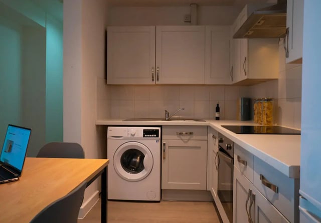Washing machine cabinets sink and oven kitchen at 6 Bedroom House at Loren House, Thesiger Street in Lincoln Student Accommodation