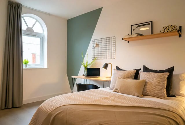 Bed desk lamp laptop cushioned pillows bedroom at 6 Bedroom House at Loren House, Thesiger Street in Lincoln Student Accommodation