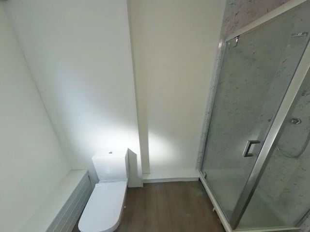 White toilet and glass shower enclosure bathroom at 5 Bedroom House at 121, Tyler House, Canwick Road in Lincoln Student Accommodation