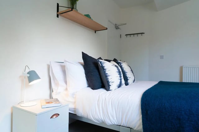 Bed with pillows and blue throw bedroom at 5 Bedroom House at 121, Tyler House, Canwick Road in Lincoln Student Accommodation