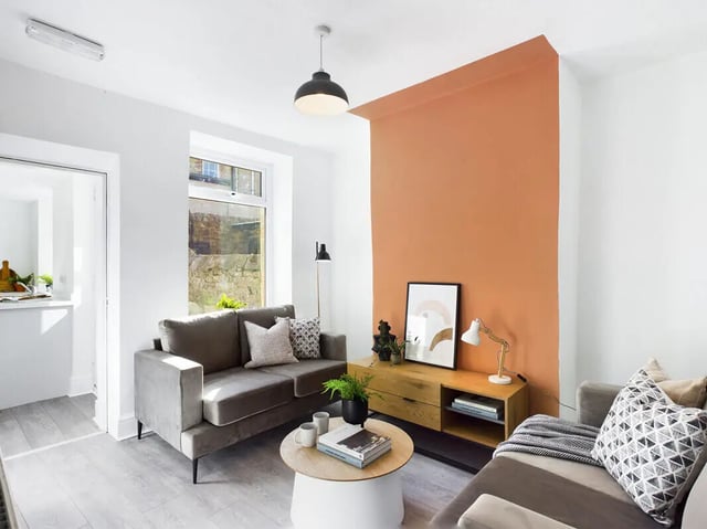 Sofa coffee table cabinet artwork and lamps living room at 5 Bedroom House at 31, Gladstone Terrace in Lancaster Student Accommodation
