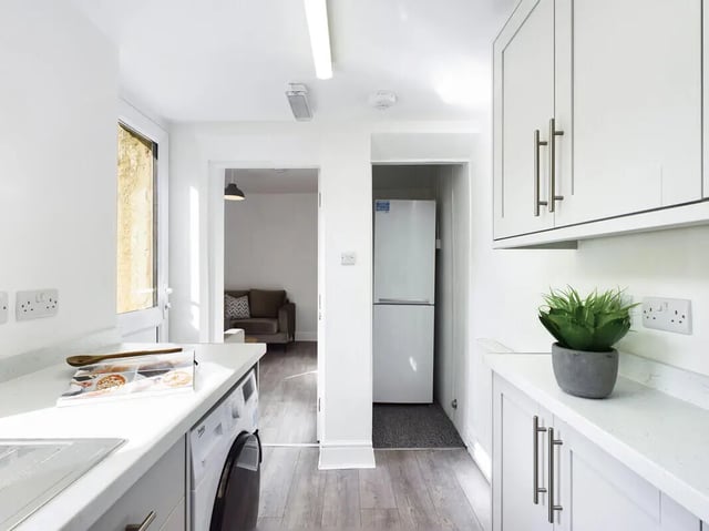 Washing machine, fridge, sofa, plant, kitchen at 5 Bedroom House at 31, Gladstone Terrace in Lancaster Student Accommodation