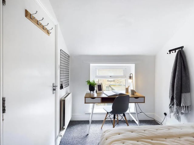 Desk chair plant lamp and bed bedroom at 5 Bedroom House at 31, Gladstone Terrace in Lancaster Student Accommodation