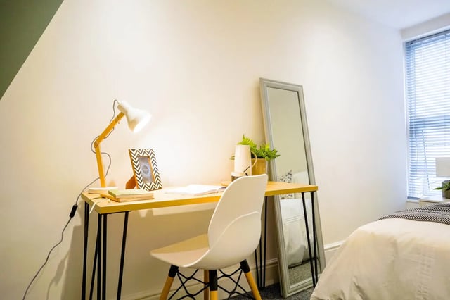 Desk lamp picture frame chair mirror bedroom study area at 6 Bedroom House at 1, Baggholme Road in Lincoln Student Accommodation