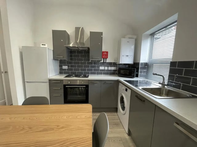 Modern grey kitchen with fridge oven microwave washing machine kitchen at 2 Bedroom House at 20 B, Portland Street in Lincoln Student Accommodation