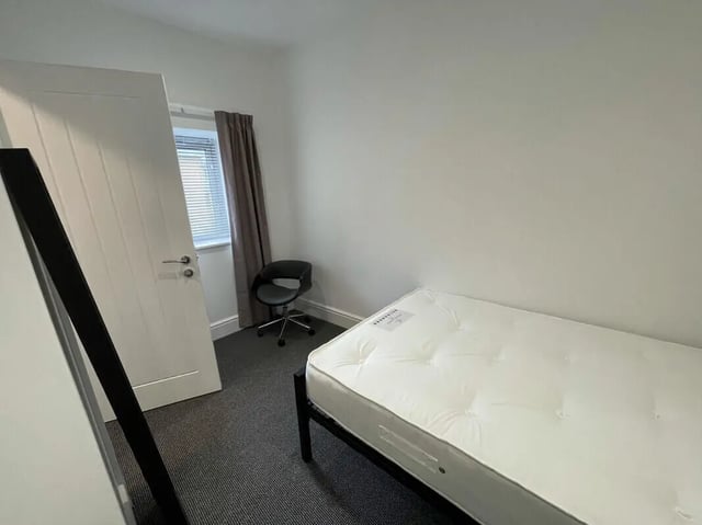 Bed mattress chair and door Bedroom at 2 Bedroom House at 20 G, Portland Street in Lincoln Student Accommodation