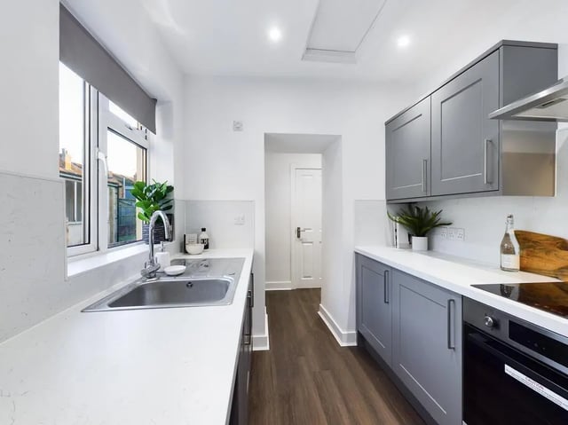 Grey cabinets sink faucet countertop window kitchen at 6 Bedroom House at 53, Ripon Street in Lincoln Student Accommodation