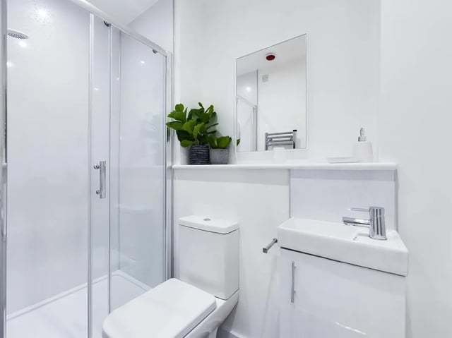 Modern white shower toilet and sink bathroom at 6 Bedroom House at 53, Ripon Street in Lincoln Student Accommodation