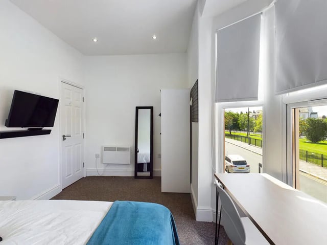 Bed with TV and desk bedroom at 4 Bedroom House at 107, Hall Lane in Liverpool Student Accommodation