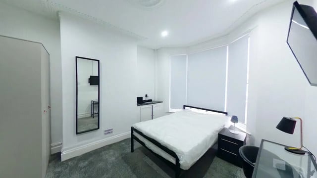 Bed wardrobe mirror desk with laptop bedroom at 4 Bedroom House at 120, Adelaide Road in Liverpool Student Accommodation