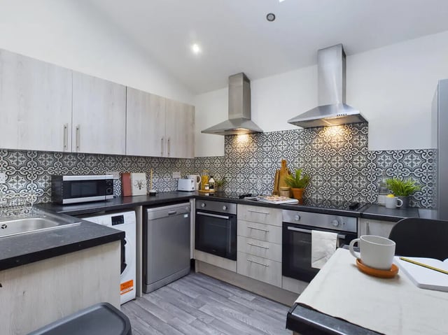 Kitchen with microwave dishwasher ovens and cabinets kitchen at 6 Bedroom House at 154, Empress Road in Liverpool Student Accommodation