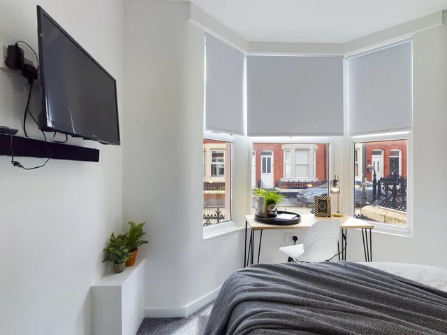 TV plants desk and chair bedroom at 6 Bedroom House at 154, Empress Road in Liverpool Student Accommodation