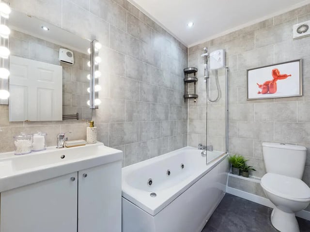 Sink bathtub toilet with artwork bathroom at 6 Bedroom House at 154, Empress Road in Liverpool Student Accommodation