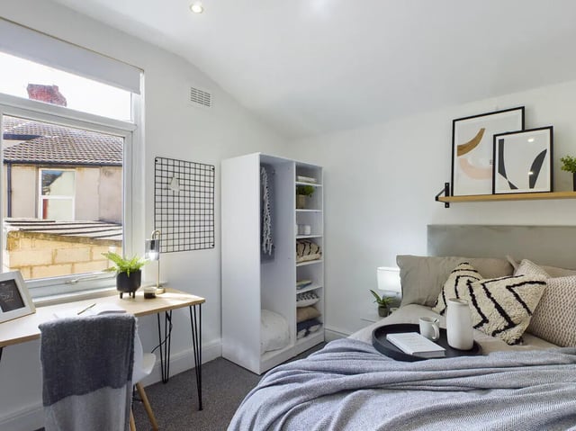 Desk closet and bed with pillows bedroom at 6 Bedroom House at 154, Empress Road in Liverpool Student Accommodation