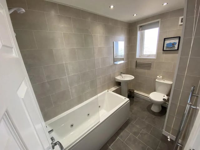 Bathtub sink toilet shower with tiled walls bathroom at 3 Bedroom House at 94, Minster Court in Liverpool Student Accommodation