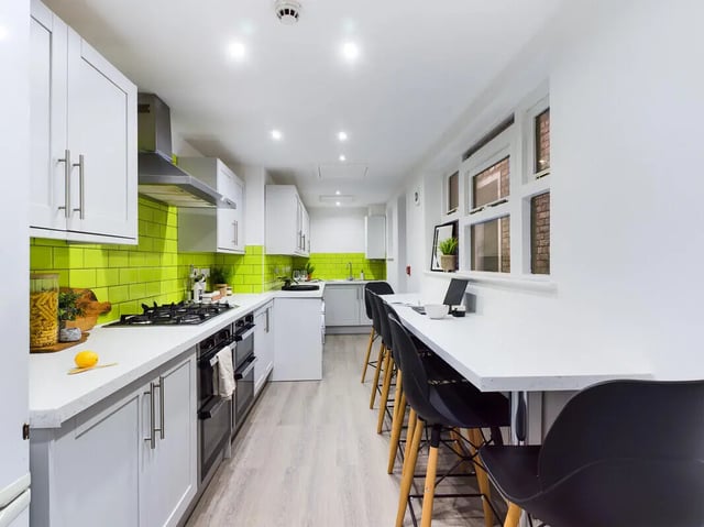Modern kitchen with breakfast bar and seating kitchen at 8 Bedroom House at 213, Smithdown Road in Liverpool Student Accommodation