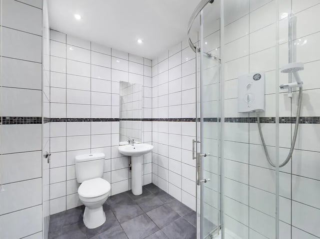 Toilet sink shower stall with glass door Bathroom at 8 Bedroom House at 213, Smithdown Road in Liverpool Student Accommodation