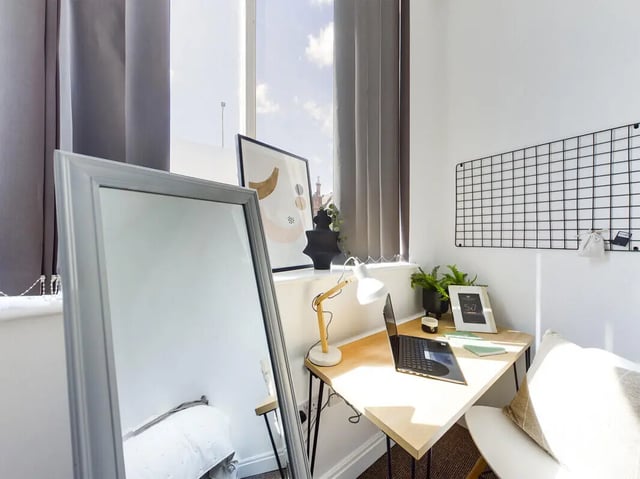 Mirror desk with laptop and lamp study area at 8 Bedroom House at 213, Smithdown Road in Liverpool Student Accommodation