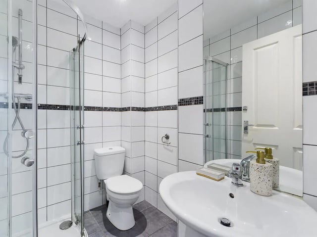 Shower toilet sink with soap dispensers bathroom at 8 Bedroom House at 213, Smithdown Road in Liverpool Student Accommodation