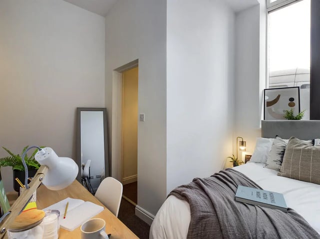 Desk lamp notebook mirror bed Bedroom at 8 Bedroom House at 213, Smithdown Road in Liverpool Student Accommodation