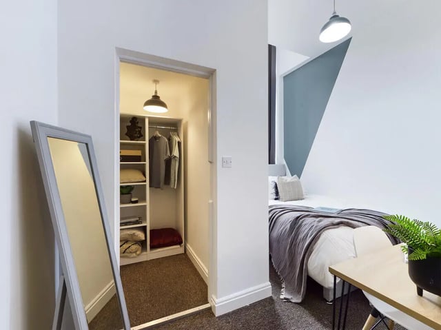 Closet with shelves and clothes bed and mirror bedroom at 8 Bedroom House at 213, Smithdown Road in Liverpool Student Accommodation