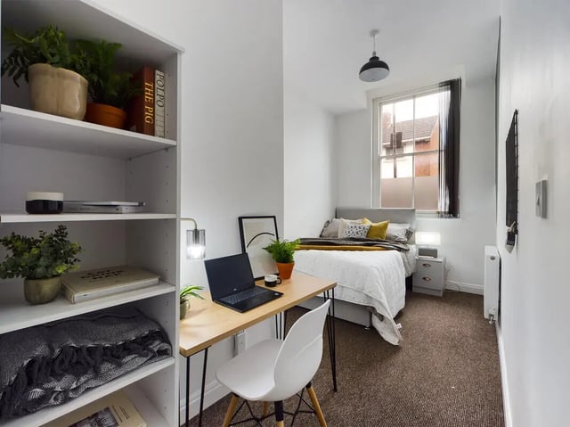 Desk with laptop and bed bedroom at 8 Bedroom House at 213, Smithdown Road in Liverpool Student Accommodation