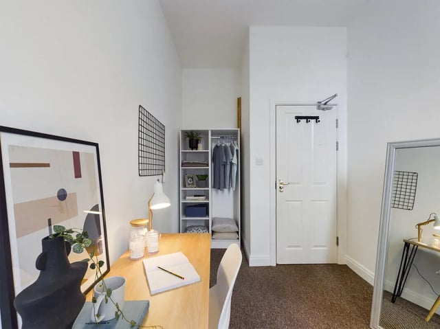 Desk plant wardrobe and abstract art bedroom at 8 Bedroom House at 213, Smithdown Road in Liverpool Student Accommodation