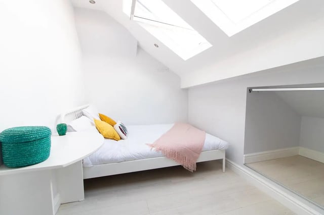 White bed pillows green basket white desk bedroom at 6 Bedroom House at 85, Halsbury Road in Liverpool Student Accommodation