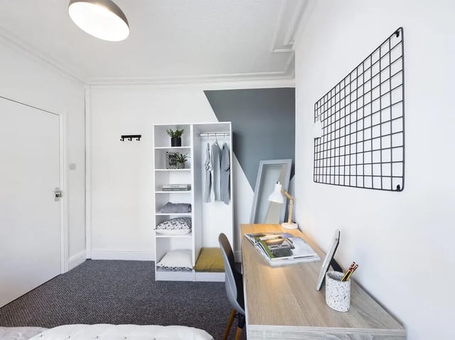 Desk shelves wardrobe and hanging clothes bedroom at 6 Bedroom House at 3, Crofton Street in Manchester Student Accommodation